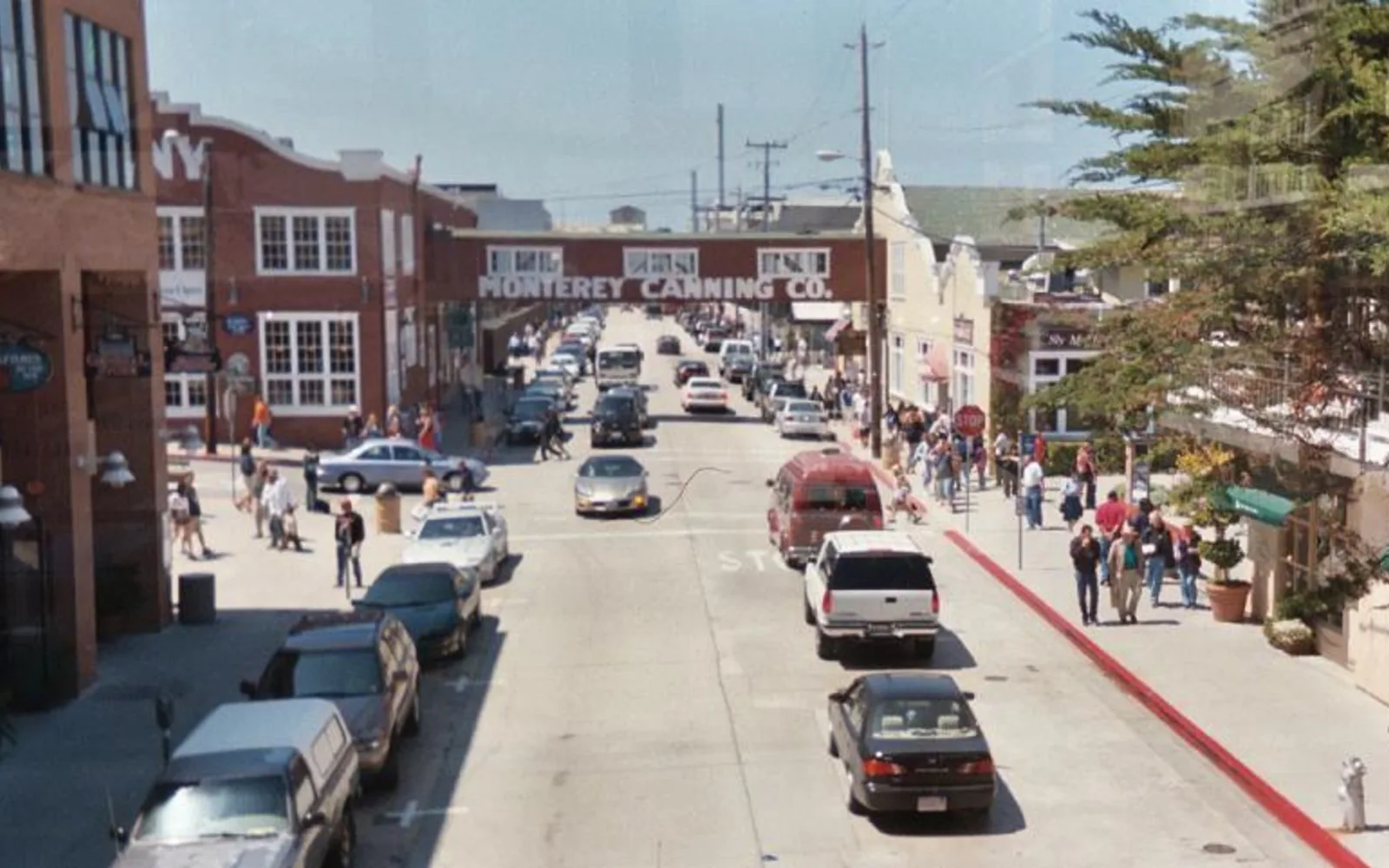 Cannery Row waterfront buildings in Monterey, California, with shops and restaurants along the historic street